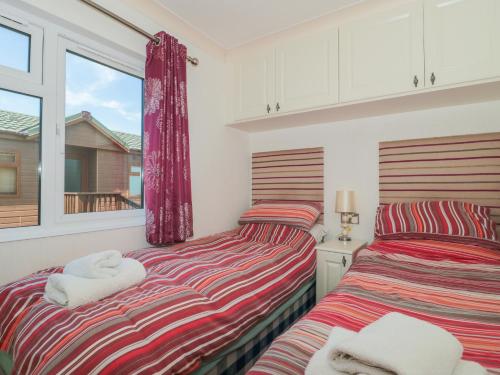 Ένα ή περισσότερα κρεβάτια σε δωμάτιο στο Bramley Lodge