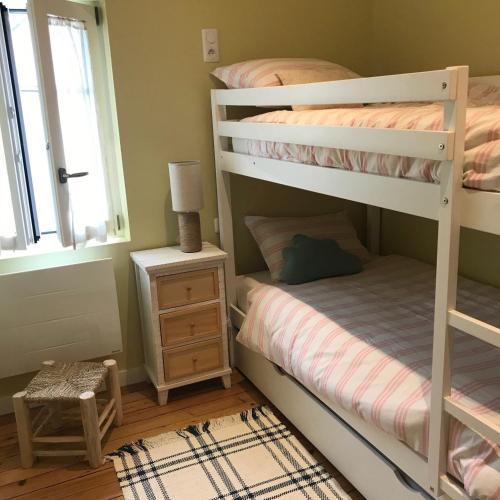Llit o llits en una habitació de Maison Villa