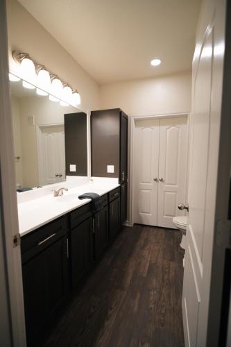 a bathroom with two sinks and a large mirror at Charming 2 bedroom, 2 bath apartment in Austin