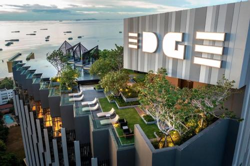 an overhead view of a building with chairs and trees at Edge Central # UTrip in Pattaya