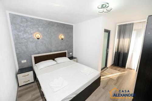 Ένα ή περισσότερα κρεβάτια σε δωμάτιο στο Casa Alexander