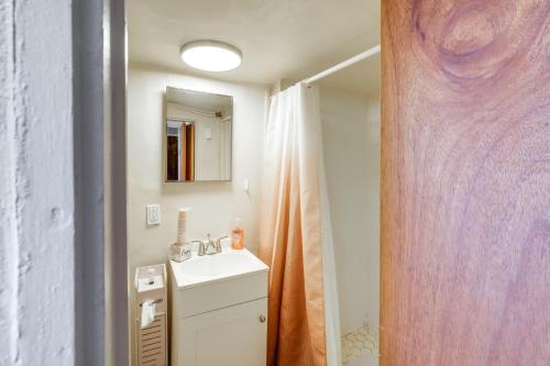 a bathroom with a sink and a mirror at Pecos Vacation Rental Near Rodeo Arena! in Pecos