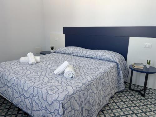 a bedroom with a bed with two pillows on it at B&B Aquas in Sardara