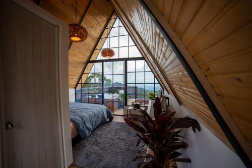 a room with a bed and a large window at Kavas Natural Connection in Salento