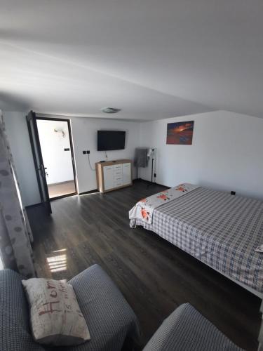 Ένα ή περισσότερα κρεβάτια σε δωμάτιο στο Casa Bon Relax , Rooms&Apartaments