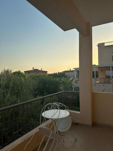 a balcony with a table and chairs on a balcony at Hotel America in Marina di Camerota