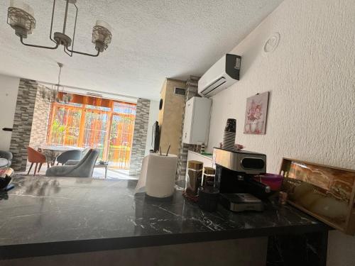 a kitchen with a counter top in a room at Villa Zeri in Prizren