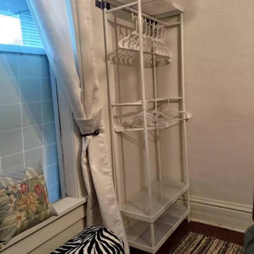 a room with a window with a curtain and shelves at Easy UW, Downtown Access in Seattle