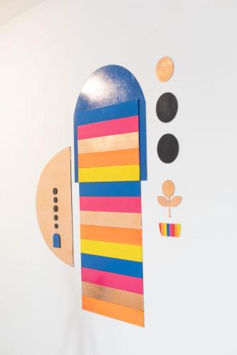 a colorful wooden skateboard with a rainbow at Solara Art Hotel by Amak in Cusco