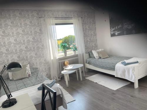 Postel nebo postele na pokoji v ubytování Ödeshög Modernt och stilfullt B&B