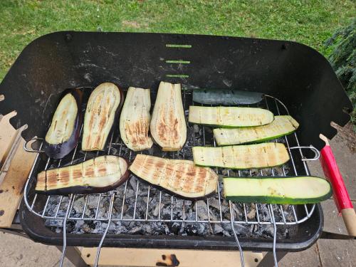 a bunch of vegetables cooking on a grill at ZenVerand in Saint-Vérand
