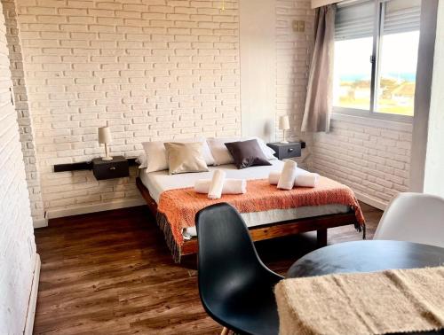 Postel nebo postele na pokoji v ubytování Portobello Suites Hotel