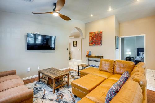 a living room with a couch and a table at Spacious Mesquite Home about 3 Mi to Golf Courses! in Mesquite