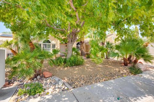 a home with palm trees and a driveway at Spacious Mesquite Home about 3 Mi to Golf Courses! in Mesquite
