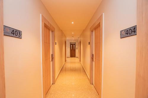a hallway with doors and a long corridor at Hotel Vistara in Kathmandu