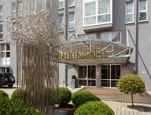 a building with a sign for a hotel at Hotel Rheingold in Bayreuth