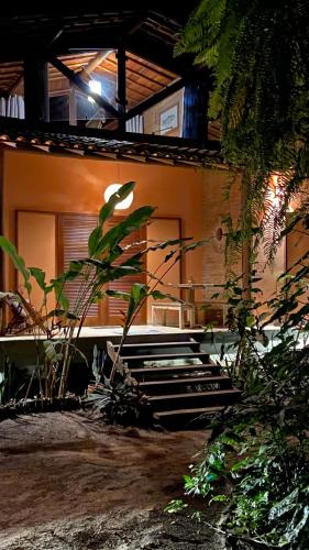 a house with a bunch of stairs in front of it at Vila Pitanga - Arandis in Marau
