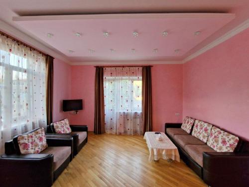 a living room with a couch and a table at Jermuk Villa Imperial in Jermuk