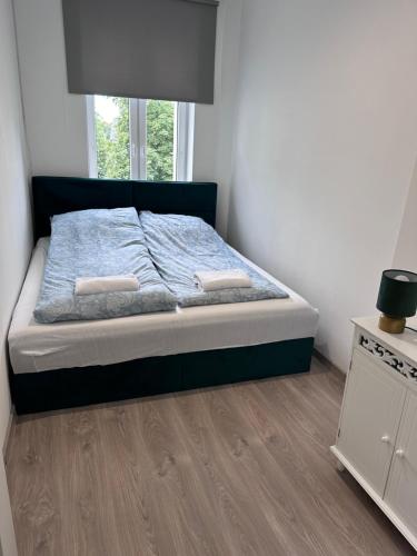 Postel nebo postele na pokoji v ubytování Apartament w sercu Szczecinka