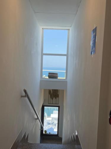 a stairway with a window in a building at Hotel Klein Wien in Piano di Sorrento