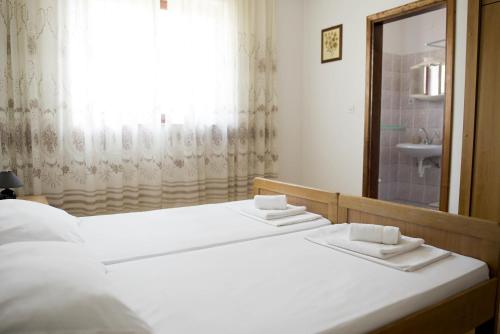 Postel nebo postele na pokoji v ubytování Seaside Apartments