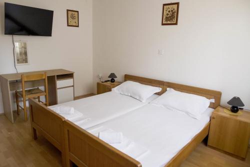 Postel nebo postele na pokoji v ubytování Seaside Apartments