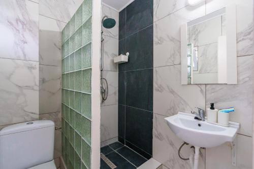 a bathroom with a toilet and a sink at Deea Marii Costinesti in Schitul