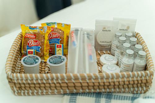 a basket filled with drinks and snacks on a table at Cozy Double Private Room, Comfy Bed, Free Parking in Toronto