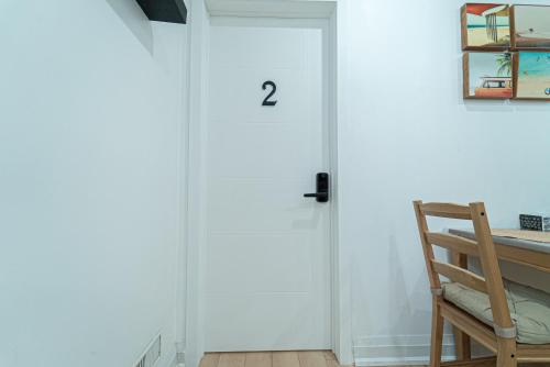 a room with a door with the number two on it at Cozy Double Private Room, Comfy Bed, Free Parking in Toronto