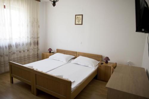 Postel nebo postele na pokoji v ubytování Seaside Apartments