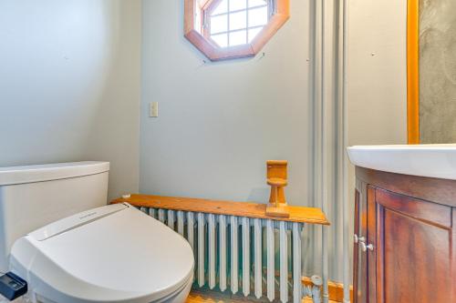 a bathroom with a toilet and a sink at Saratoga Springs Home with Hot Tub Walk to Downtown in Saratoga Springs