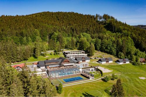 an aerial view of a large building in the mountains at Wellness hotel Horal, Velké Karlovice in Velké Karlovice