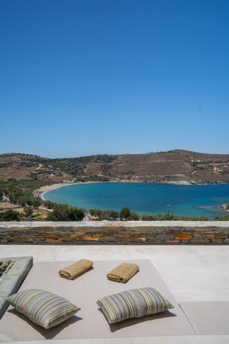 two pillows on a table with a view of a lake at Gaia & Thalassa Villa Orionas in Otziás
