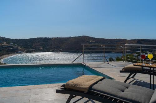 a swimming pool with a view of the water at Gaia & Thalassa Villa Orionas in Otziás
