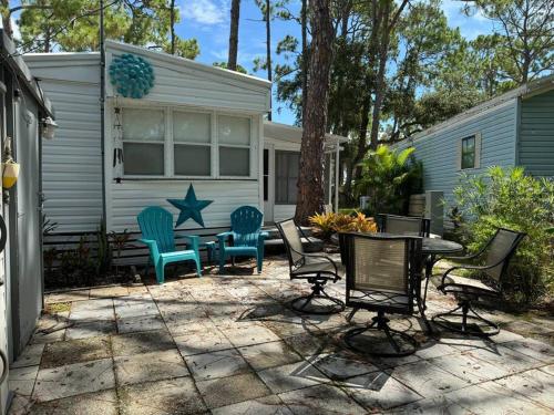 a patio with chairs and a table in front of a house at Venice Bungalow in Venice