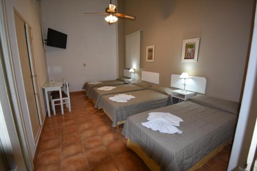 Postel nebo postele na pokoji v ubytování Hotel Plaza