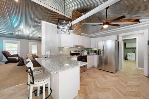 a kitchen with a counter top and a refrigerator at Healing Adventures in Claxton