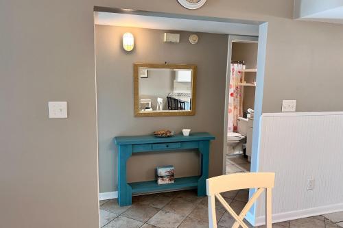 a room with a blue table and a mirror at Perdido Dunes #27 in Orange Beach