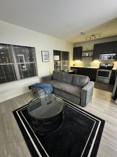 a living room with a couch and a table at Views from ATL Beltline in Atlanta