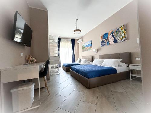 "La città delle 100 sculture" B&B BcenS con parcheggio privato - Belpasso - Etna -にあるベッド