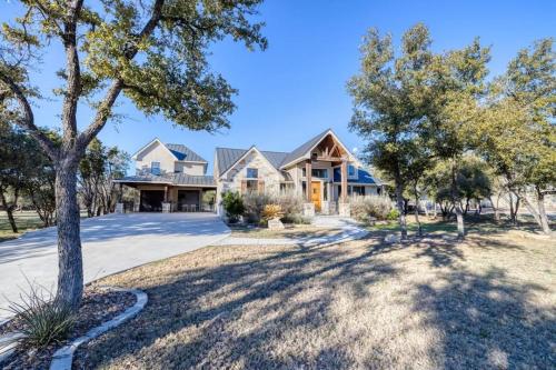 a large house with trees in front of it at Double Shotz in Concan