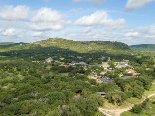 an aerial view of a village in the hills at She's Like Texas in Concan