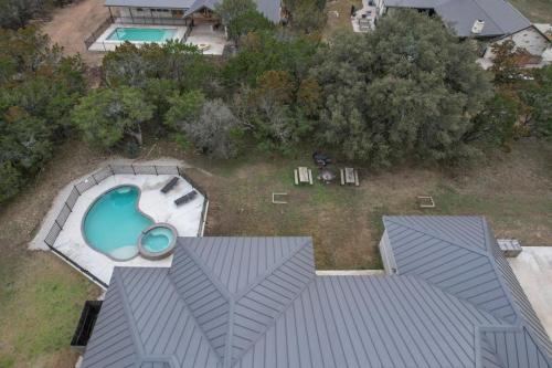 an aerial view of a backyard with a swimming pool at Driftwood in Concan
