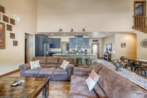 a large living room with couches and a kitchen at Rolling Rock in Concan