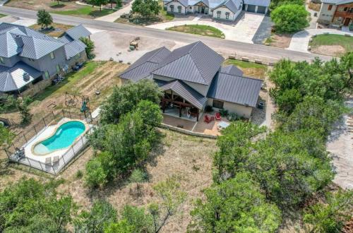 an aerial view of a house with a swimming pool at Rolling Rock in Concan
