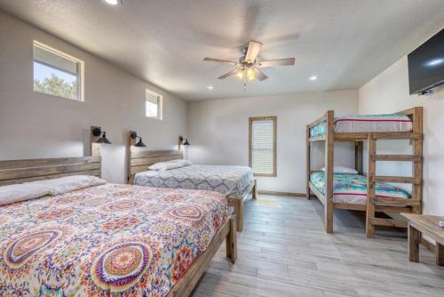 a bedroom with two beds and a bunk bed at River Ridge in Concan