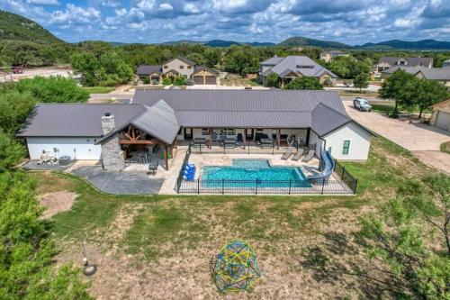 an aerial view of a house with a swimming pool at River Ridge in Concan