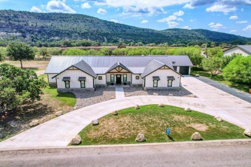 an aerial view of a house with a driveway at River Ridge in Concan