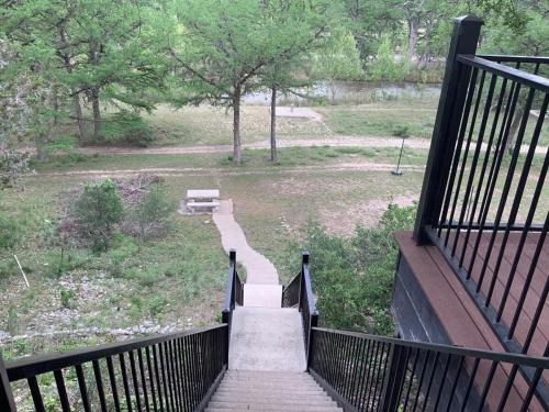 a set of stairs leading to a park with a bench at Big Cinchin' in Concan