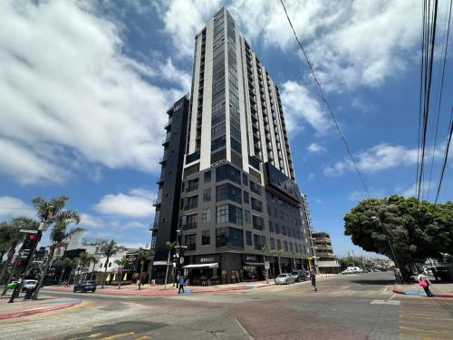 a tall building on the corner of a street at Condo Magico en Revolucion TJ in Tijuana